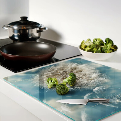 Glass kitchen board Dandelions against the sky