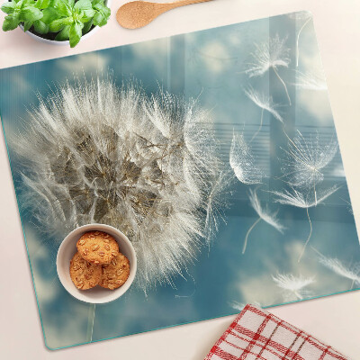 Glass kitchen board Dandelions against the sky