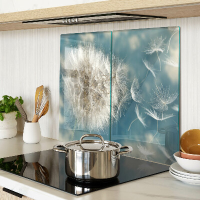 Glass kitchen board Dandelions against the sky