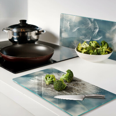 Glass kitchen board Dandelions against the sky