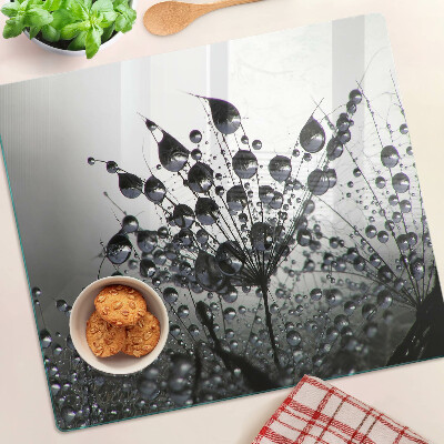 Glass chopping board Water drops on plants