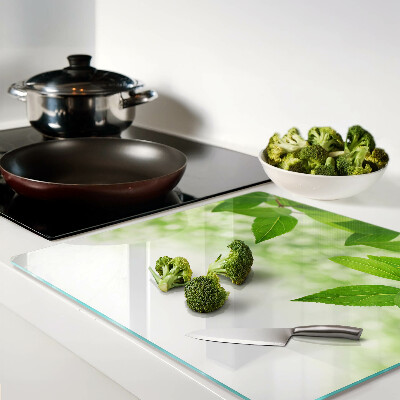 Glass chopping board Leaves against a background of blurred green