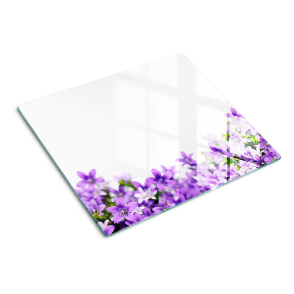 Glass kitchen board Purple flowers in the background