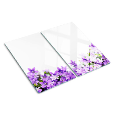 Glass kitchen board Purple flowers in the background