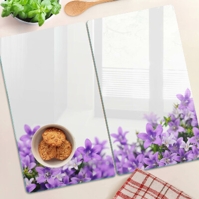 Glass kitchen board Purple flowers in the background