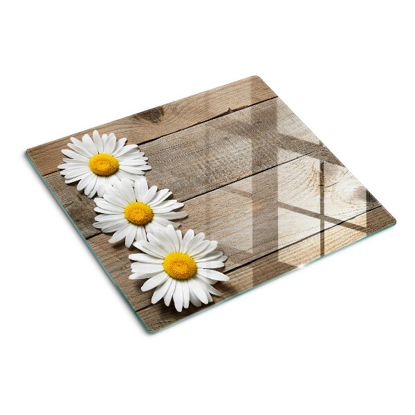 Glass chopping board Flowers on a wood background