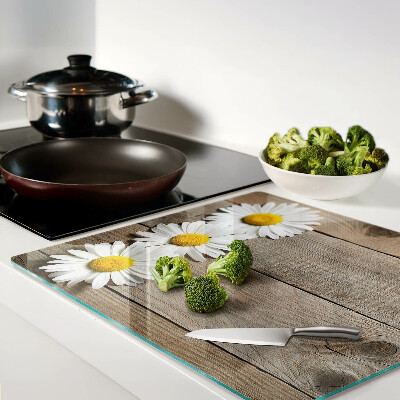 Glass chopping board Flowers on a wood background