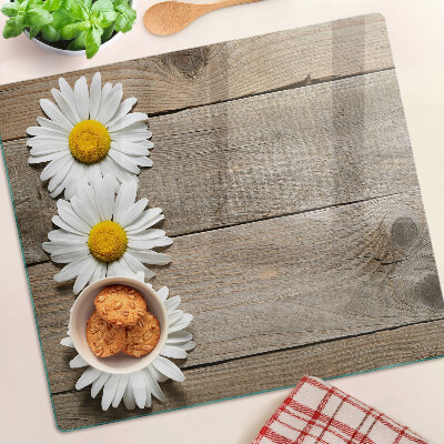 Glass chopping board Flowers on a wood background