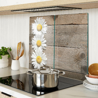 Glass chopping board Flowers on a wood background