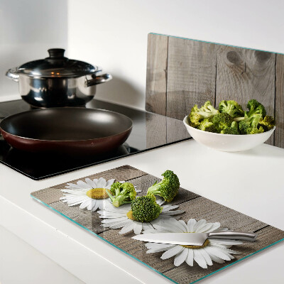 Glass chopping board Flowers on a wood background