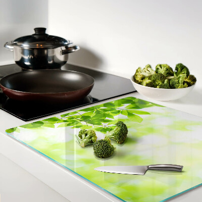 Glass chopping board Green leaves in the light