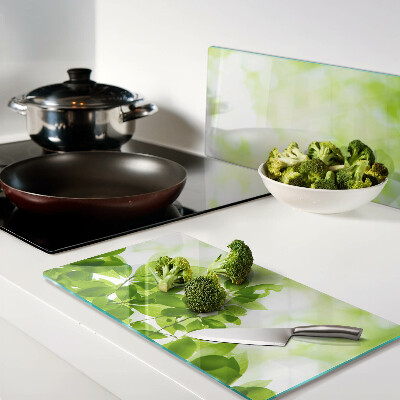Glass chopping board Green leaves in the light
