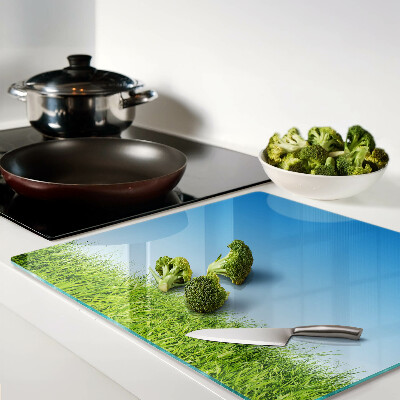 Glass kitchen board Green meadow under blue sky