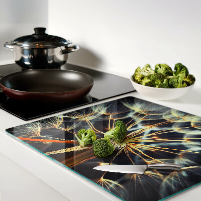 Glass chopping board Dandelions in macro photography