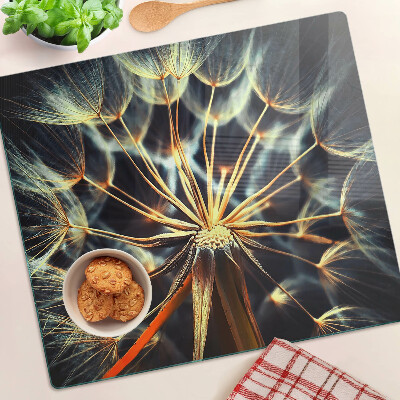 Glass chopping board Dandelions in macro photography