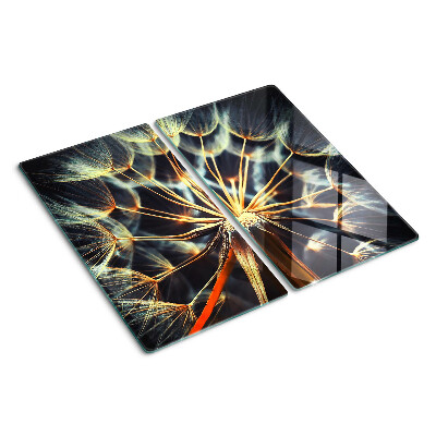 Glass chopping board Dandelions in macro photography