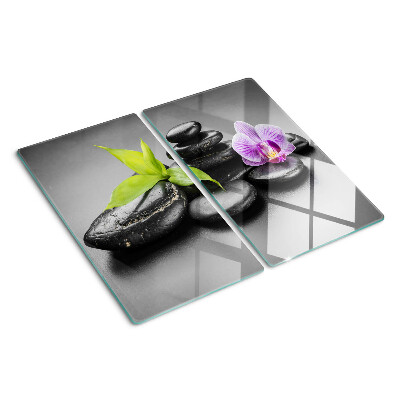 Glass kitchen board Stones and orchid on the background