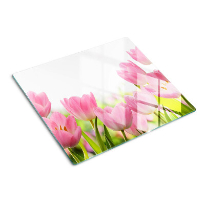 Glass kitchen board Pink tulips in the garden