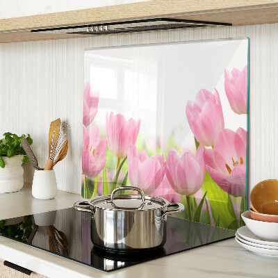 Glass kitchen board Pink tulips in the garden
