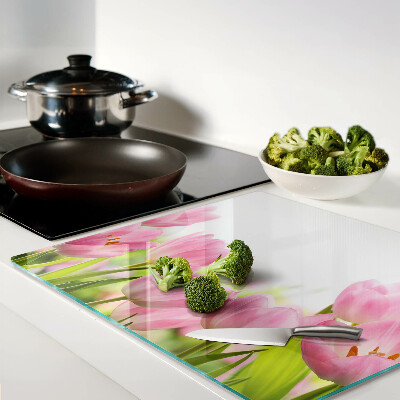Glass kitchen board Pink tulips in the garden