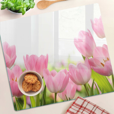 Glass kitchen board Pink tulips in the garden