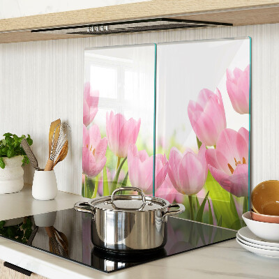 Glass kitchen board Pink tulips in the garden