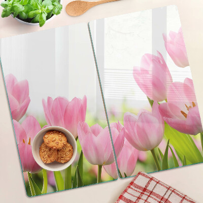 Glass kitchen board Pink tulips in the garden