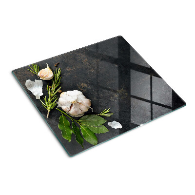 Glass chopping board Flowers and herbs on a marble background