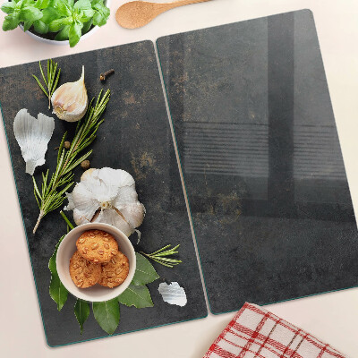 Glass chopping board Flowers and herbs on a marble background