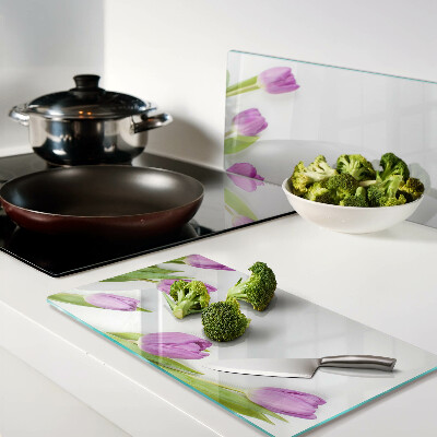 Glass chopping board Tulips on a white background