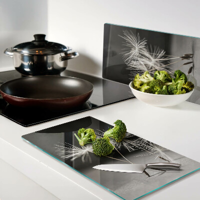 Glass kitchen board Fluffy dandelions on a monochromatic background