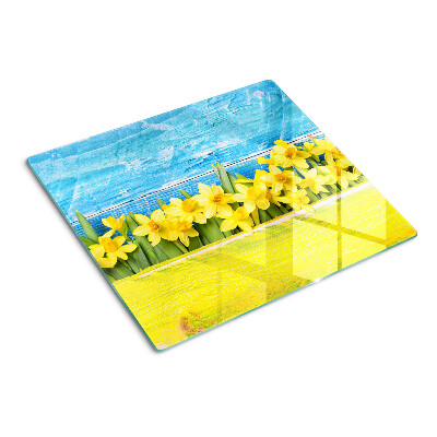 Glass kitchen board Daffodil flowers against the sky