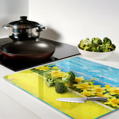 Glass kitchen board Daffodil flowers against the sky