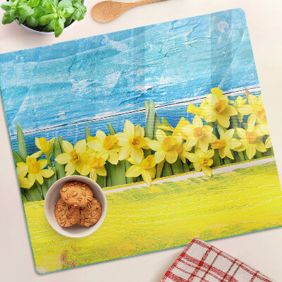 Glass kitchen board Daffodil flowers against the sky