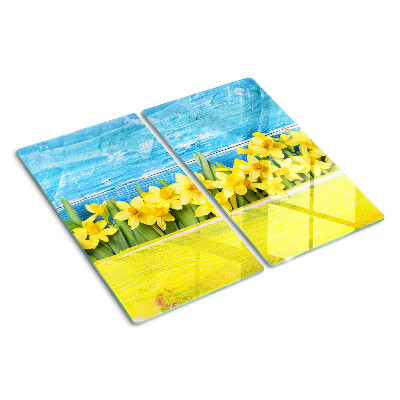 Glass kitchen board Daffodil flowers against the sky