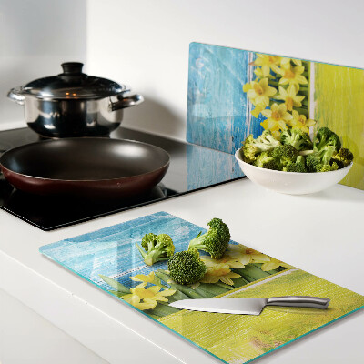 Glass kitchen board Daffodil flowers against the sky