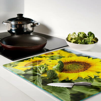 Glass chopping board Sunflowers against a green background
