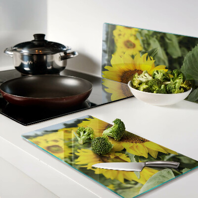 Glass chopping board Sunflowers against a green background