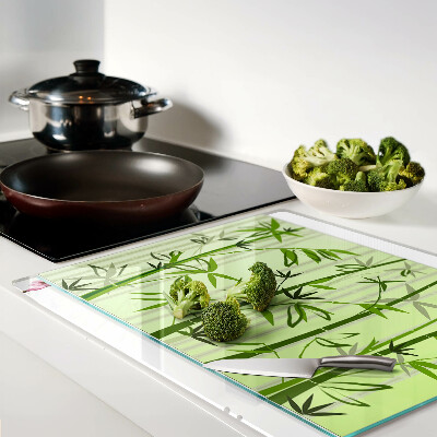 Glass kitchen board Bamboo on green background