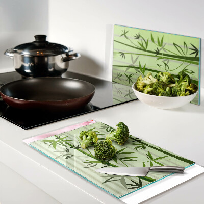Glass kitchen board Bamboo on green background