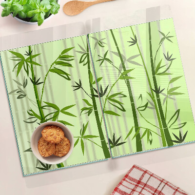 Glass kitchen board Bamboo on green background