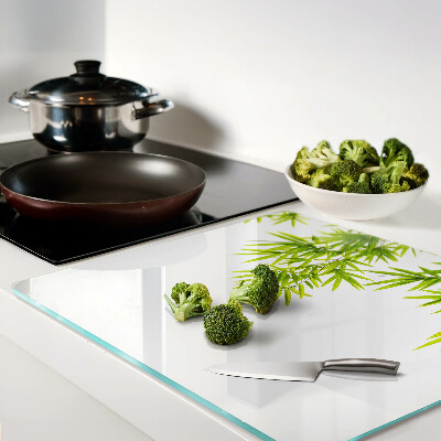 Glass chopping board Bamboo leaves on the window background
