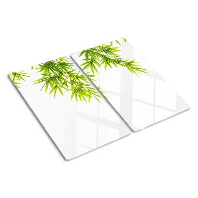 Glass chopping board Bamboo leaves on the window background