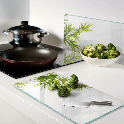 Glass chopping board Bamboo leaves on the window background
