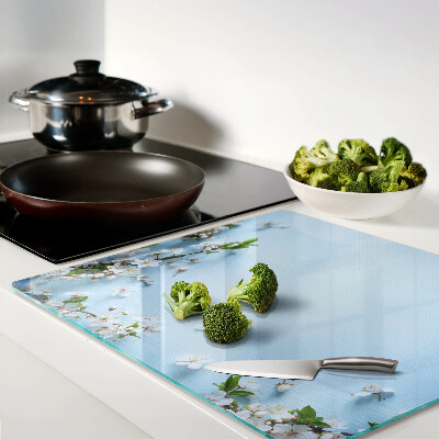 Glass chopping board Floral pattern on a blue background
