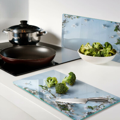 Glass chopping board Floral pattern on a blue background