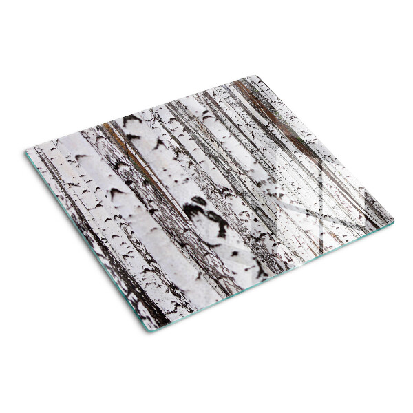 Glass chopping board White trunks of birch trees
