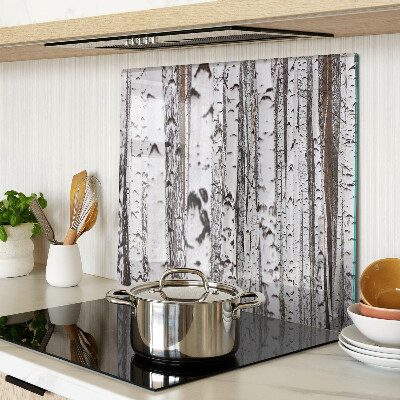 Glass chopping board White trunks of birch trees