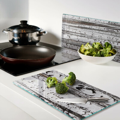 Glass chopping board White trunks of birch trees