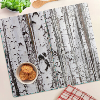 Glass chopping board White trunks of birch trees